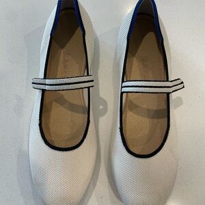 Stylish White Rothy’s Mary Jane Flats with Navy Blue Trim